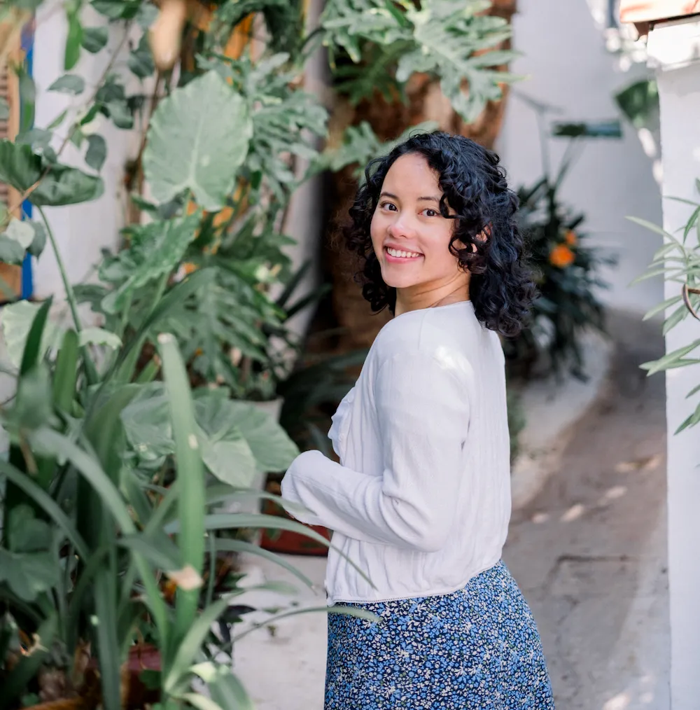 Pauline Narvas in Athens, Greece, embodying her motto 'exist loudly' as a content creator sharing insights on community building and personal growth with her 22K+ global audience